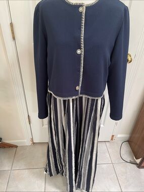 Karin Steven’s Sleeveless Navy Maxi Dress with White Striped Skirt and Jacket